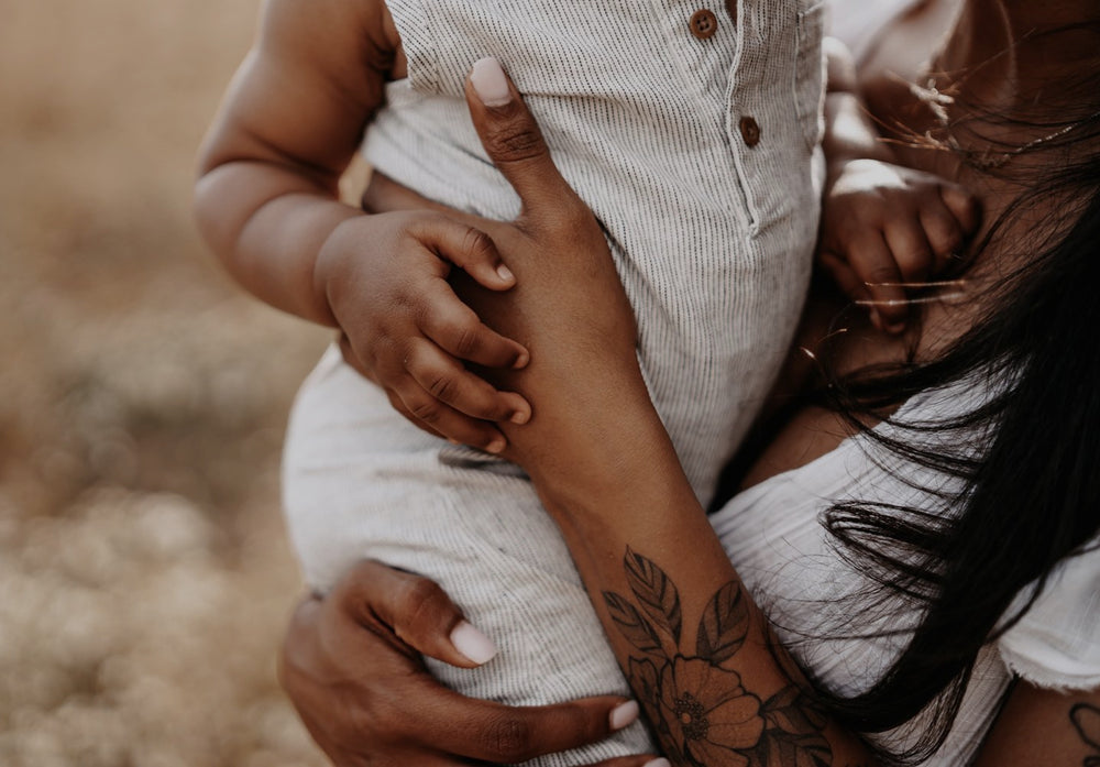 parent holding child to chest